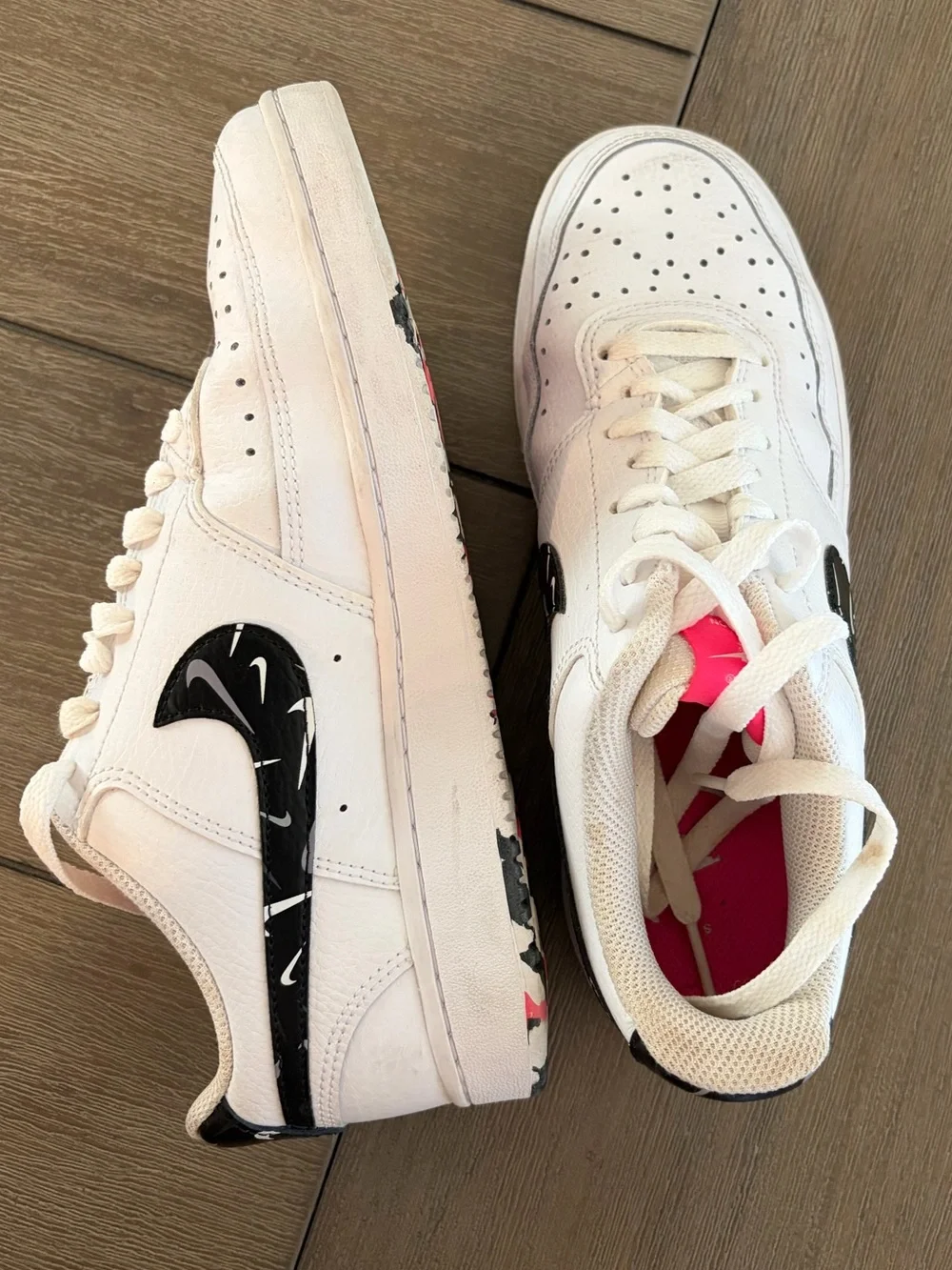 Nike White Low-Top Sneakers with Black Swoosh and Pink Insole